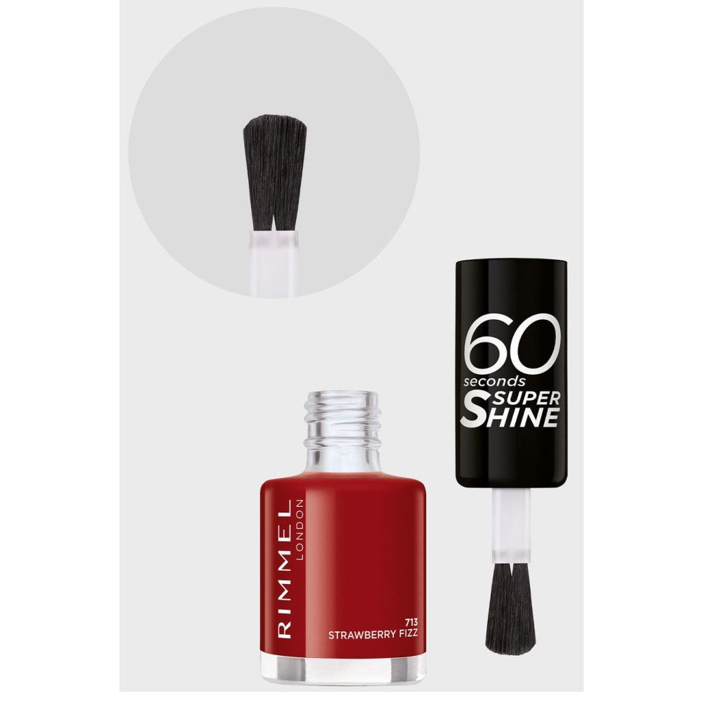 Vernis à ongles rouge, flacon avec bouchon noir. Inscription: 60 secondes Super Shine. Pinceau et flacon de vernis rouge.