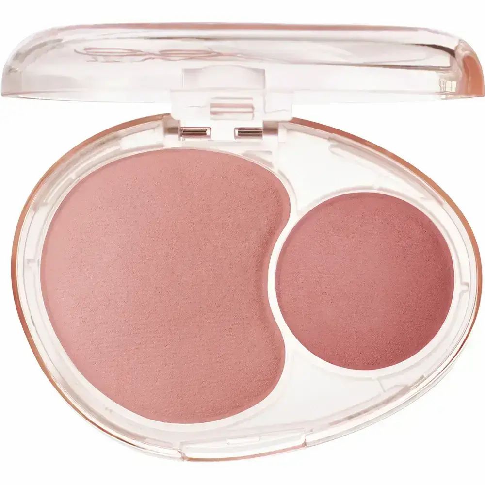 Tweekleurige blush in een ovale, transparante verpakking. Twee roze zones: een grote, onregelmatige en een kleine, ronde.