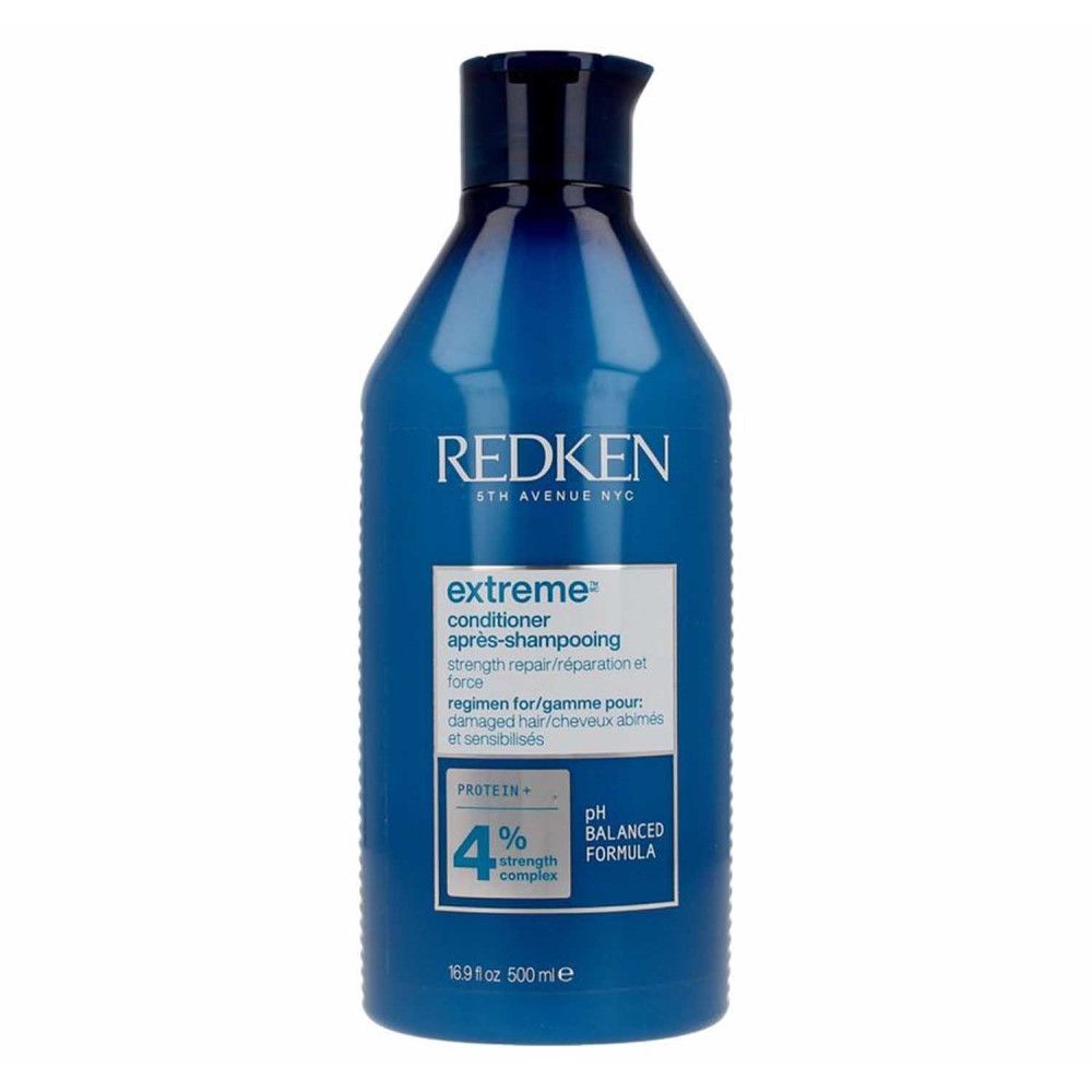 Blauwe Redken Extreme Conditioner. Fles met wit etiket. Tekst: Extreme, strength repair, pH Balanced Formula, 500ml.