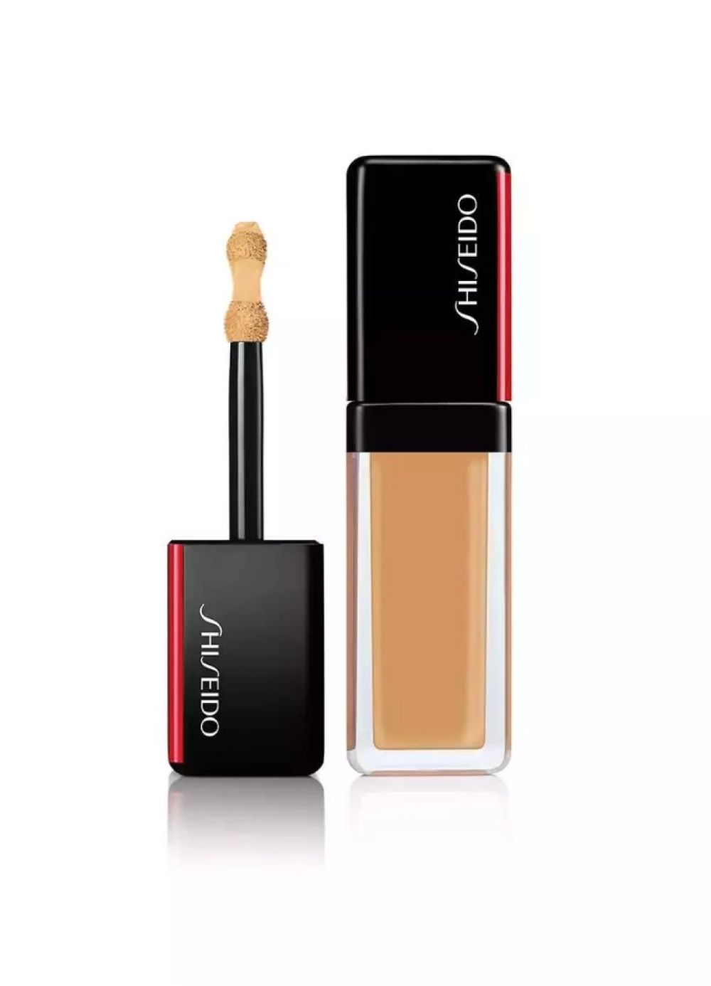 Produit cosmétique avec applicateur. Capuchon noir avec accent rouge et lettrage blanc Shiseido. Récipient contenant un liquide beige.