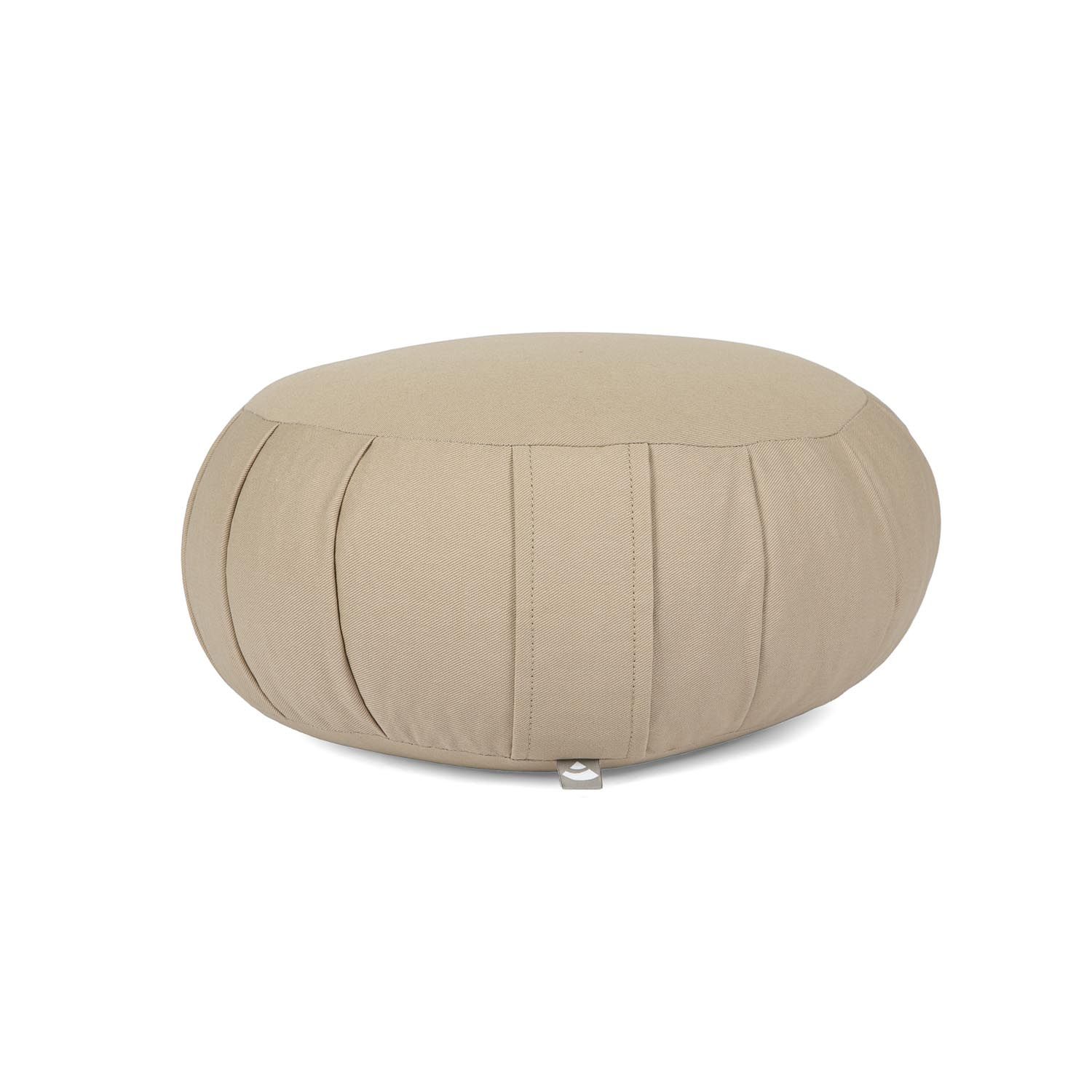 Coussin de méditation ZAFU beige, rond, avec plis sur les côtés. Sur fond clair.