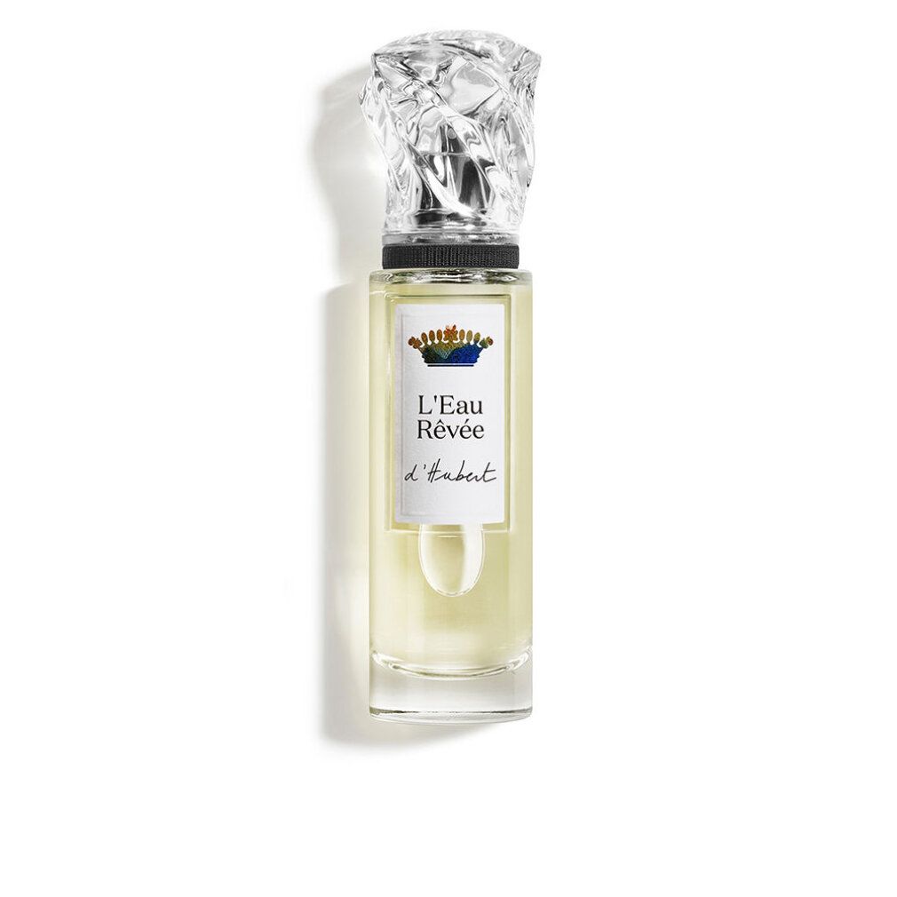 Parfumfles van helder glas met zilverkleurige dop. Het etiket toont 'L'Eau Rêvée d'Alma'.