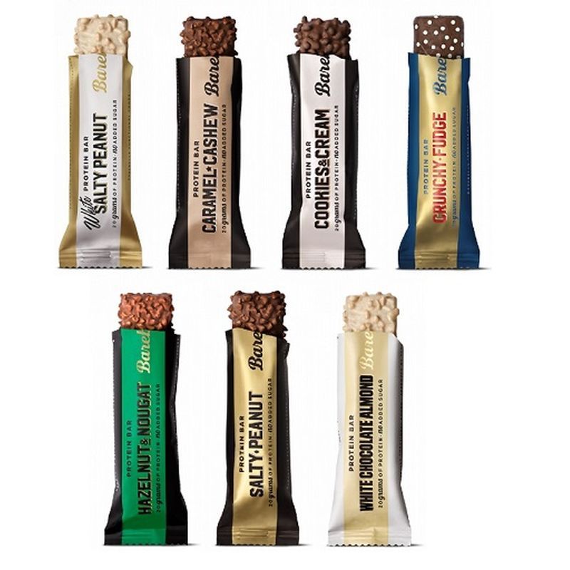 Sept barres protéinées Barebells de différentes saveurs et couleurs d'emballage.