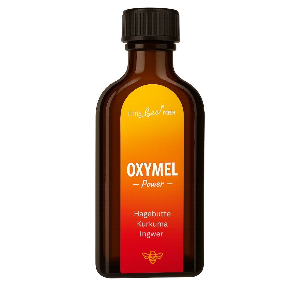 Flacon en verre brun avec bouchon noir. Étiquette avec fond jaune-orange et texte : Oxymel Power, Cynorrhodon, Curcuma, Gingembre.