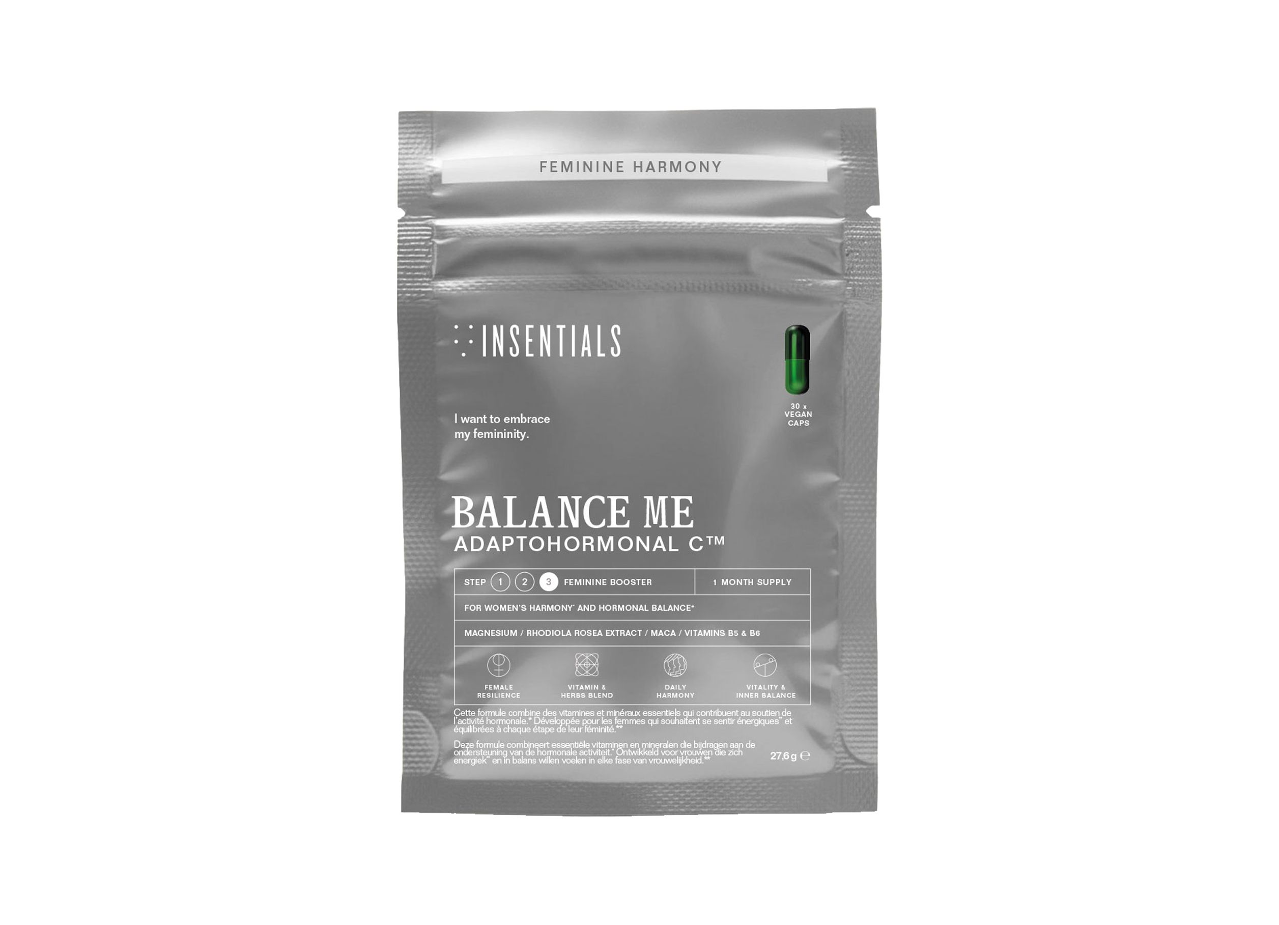Zilverkleurige verpakking met de tekst 'BALANCE ME ADAPTOHORMONAL C'. Een groene capsule is zichtbaar.