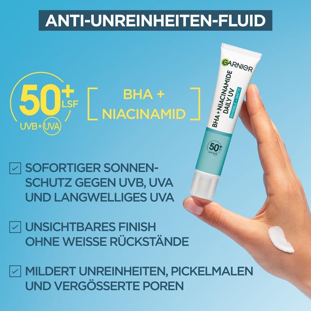 Garnier Hautklar BHA + Niacinamide Daily UV. Tube et main avec produit. Texte: 50+ SPF, BHA + Niacinamide, protection UV.