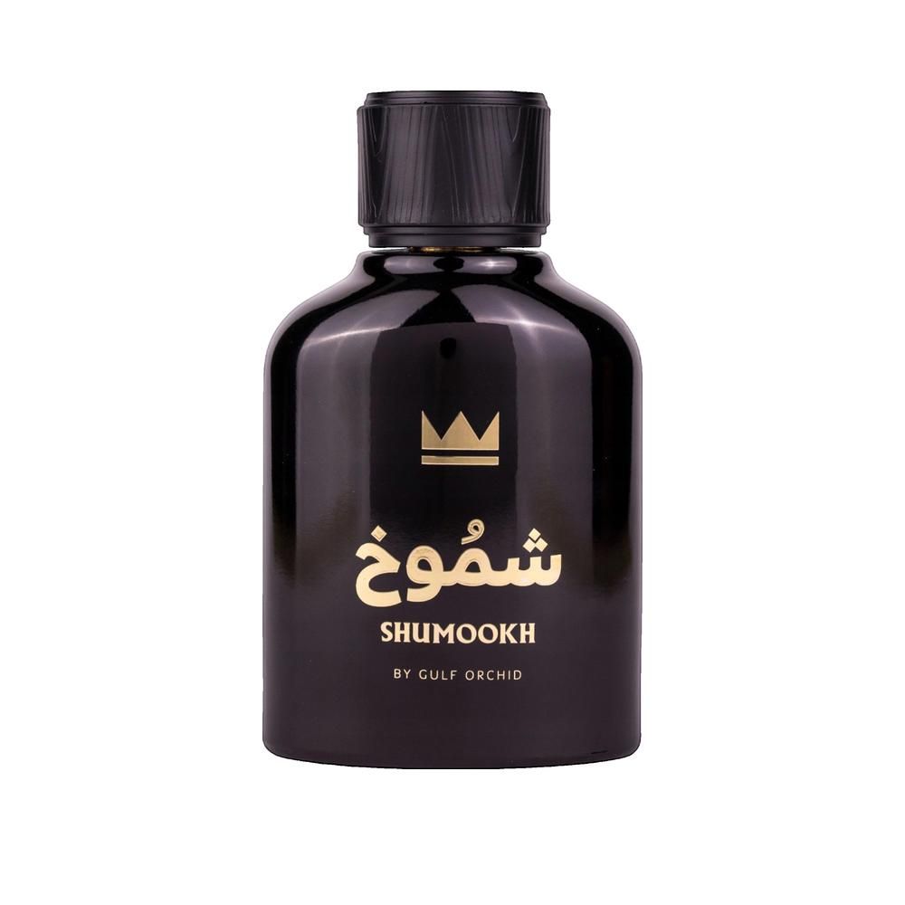 Zwarte, ronde fles met gouden tekst en kroon. Bevat Arabische tekens en "SHUMOOKH".