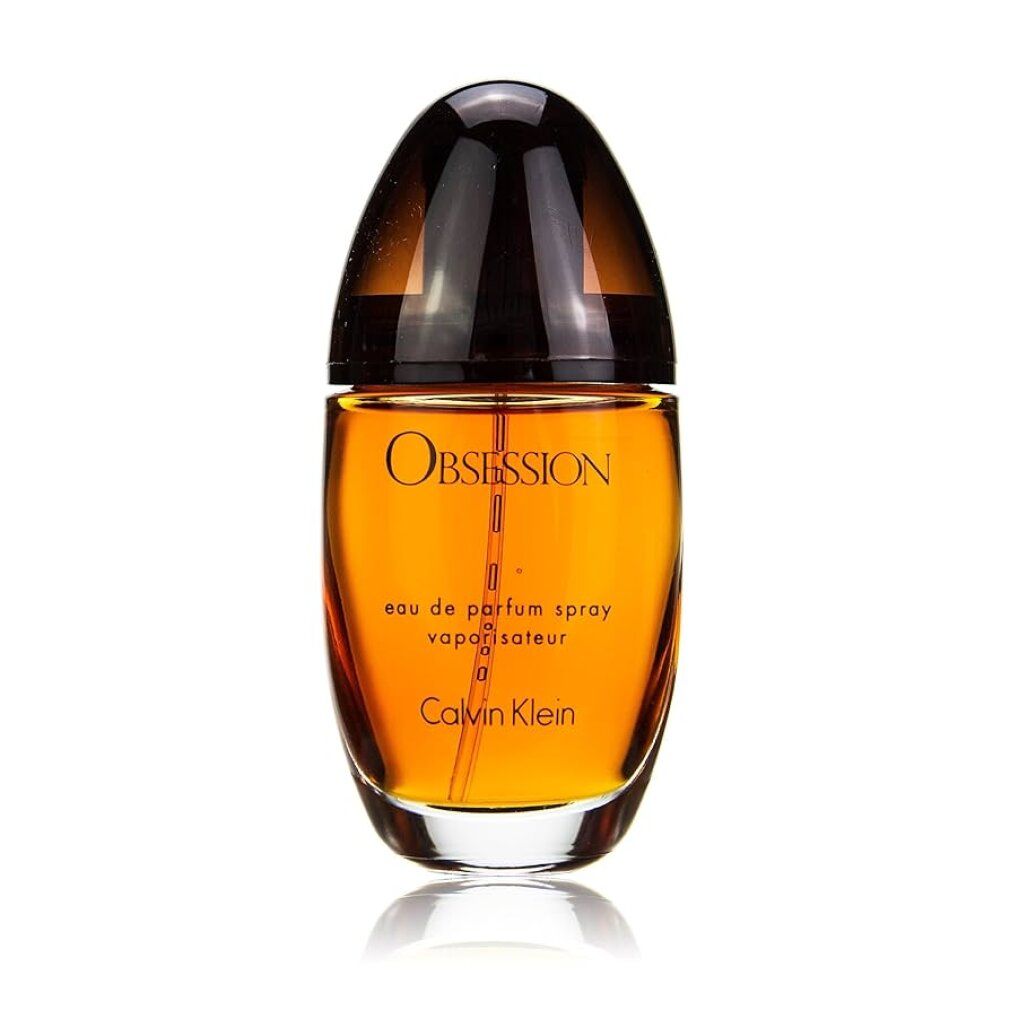 Flacon de parfum brun ovale, bouchon foncé. Inscription Obsession et Calvin Klein. Eau de Parfum Spray.