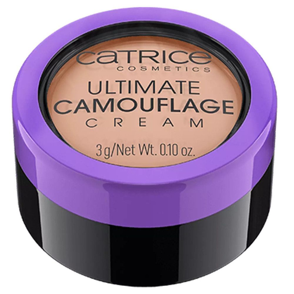 Crème correctrice dans un pot noir avec un couvercle violet. Le couvercle porte la mention "Catrice Ultimate Camouflage Cream".