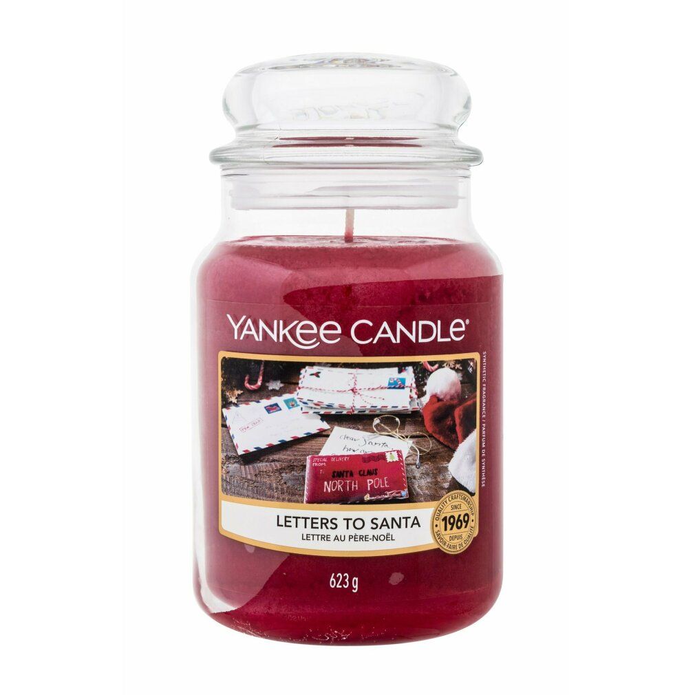 Bougie parfumée rouge en pot avec couvercle. Étiquette "Letters To Santa". Marque Yankee Candle. 623g.
