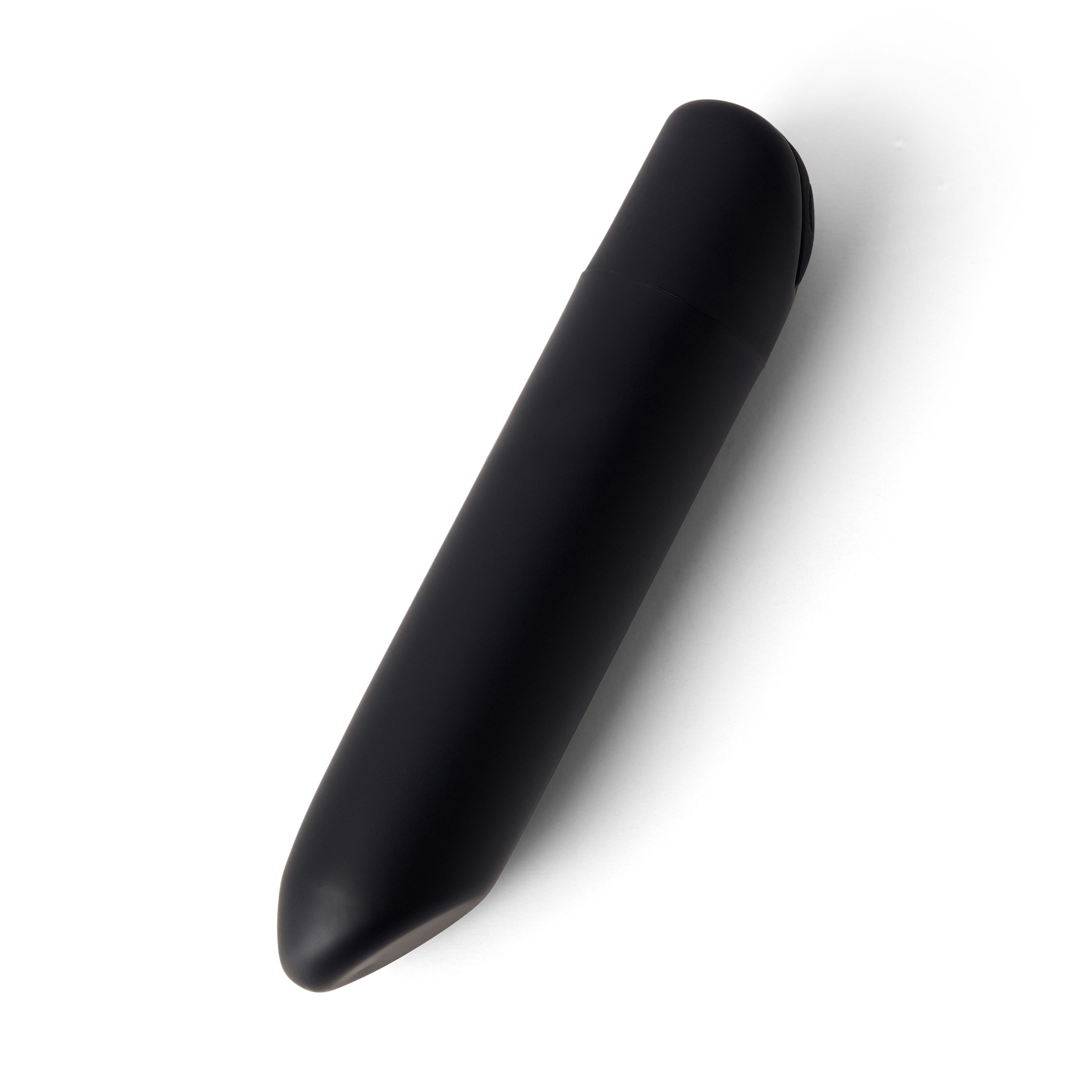 Produit de bien-être cylindrique noir. Extrémité arrondie, surface lisse. Sur fond blanc.