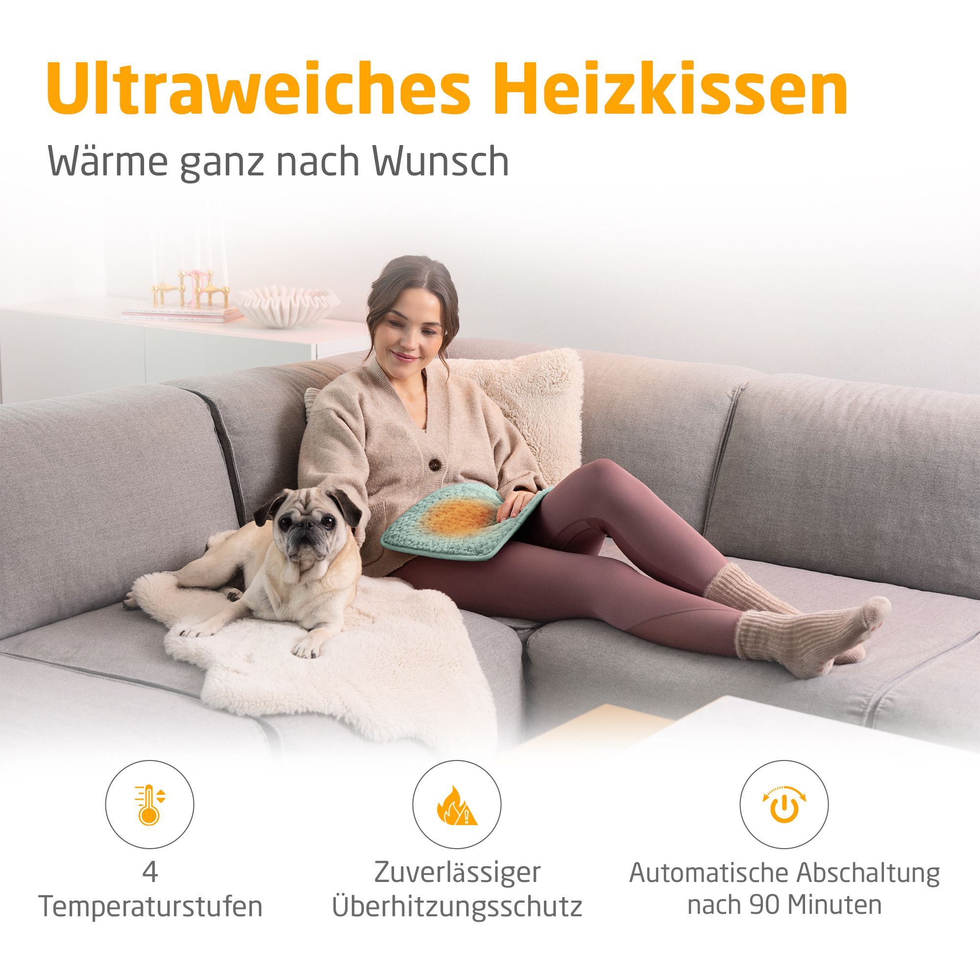 Coussin chauffant vert. Femme sur canapé avec chien. 4 niveaux de température, protection contre la surchauffe, arrêt auto.