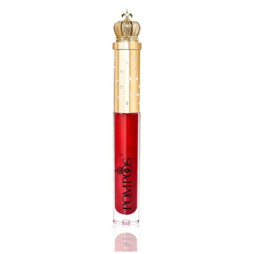 Gloss Pompöös rouge. Tube transparent avec bouchon doré et couronne. Marque et nom du produit visibles.