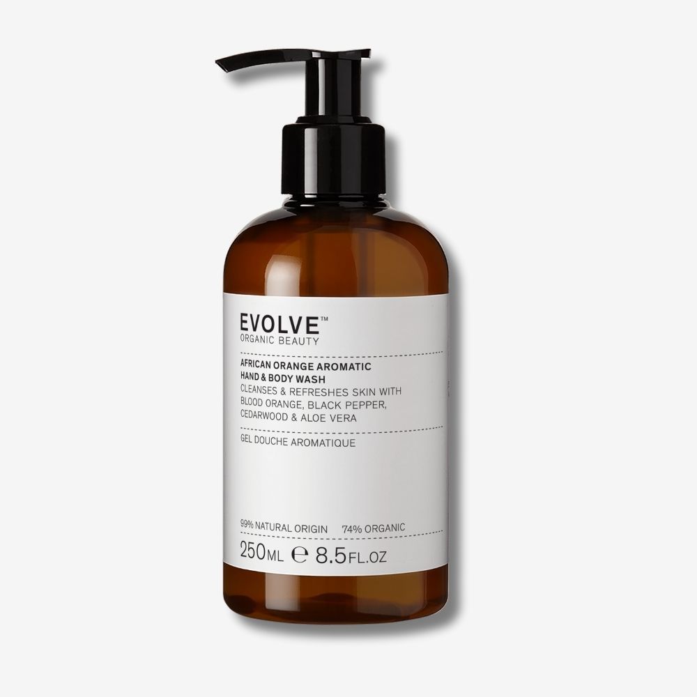 Bruine pompfles met wit etiket met Evolve Organic Beauty African Orange Aromatic Wash.