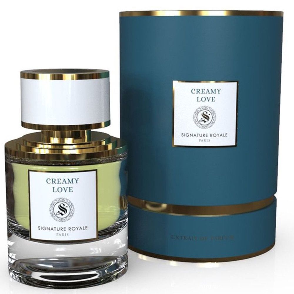 Parfumextract Creamy Love met verpakking. Fles met gouden dop en witte kap. Blauwe cilindrische verpakking.
