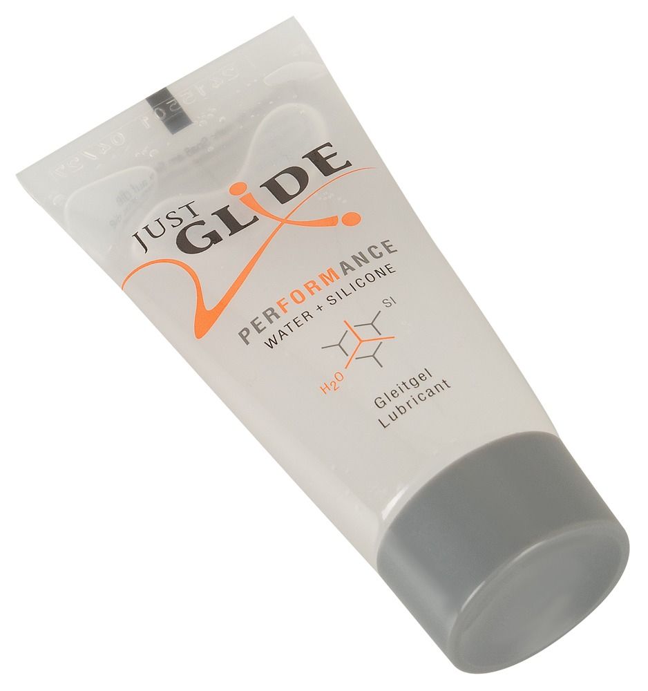 Tube met transparante gel. Opschrift: JUST GLIDE PERFORMANCE. Water + Silicone. Medisch glijmiddel.
