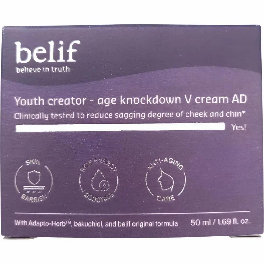 Donkerpaarse doos met opschrift: belif, Youth creator - age knockdown V cream AD. Tekst: Klinisch getest, met Adapto-Herb, Bakuchiol. Symbolen.