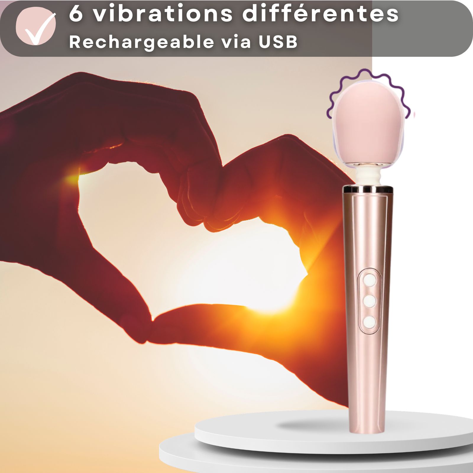 Vibrateur rose. Texte: 6 vibrations différentes, rechargeable USB. Forme de cœur avec les mains. Tête rose, manche cylindrique.