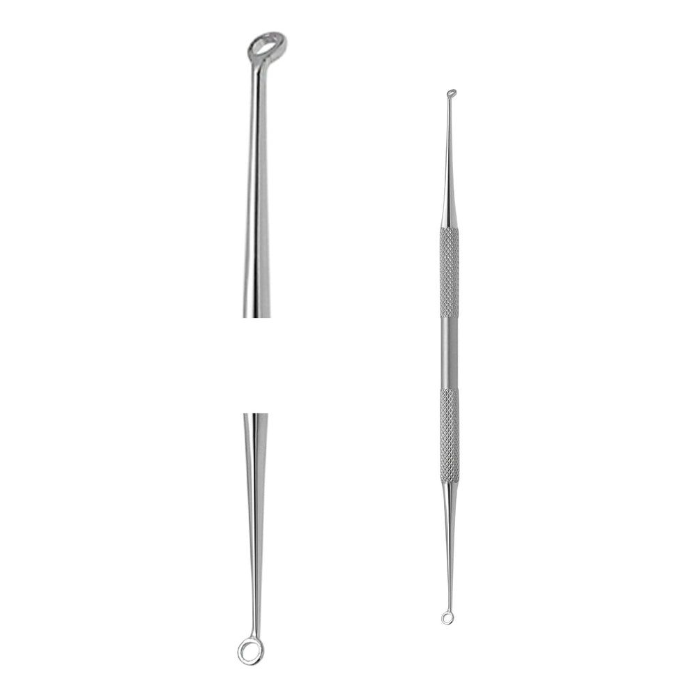 Trois outils de soins de la peau en acier inoxydable. Un outil avec une boucle, un autre avec une pointe et une boucle, et un troisième avec une pointe.