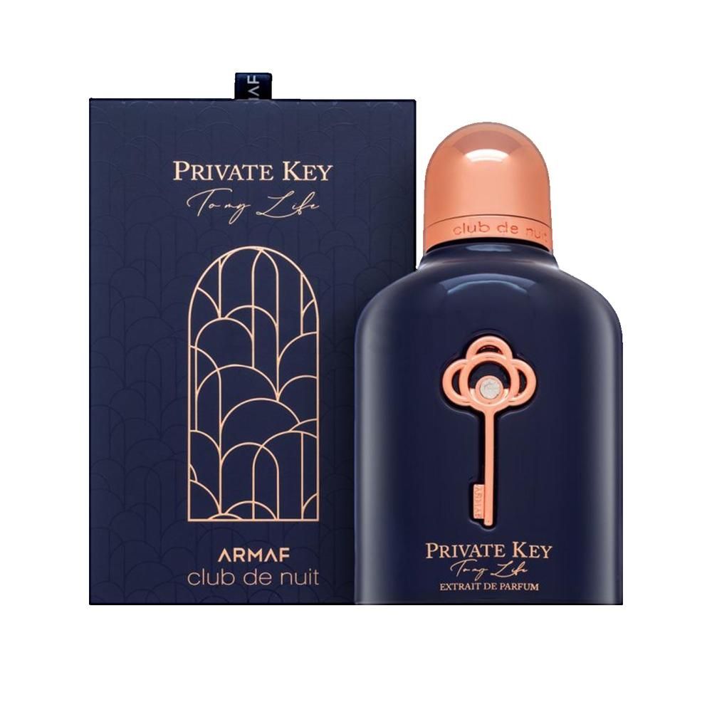 Donkerblauwe parfumfles met koperkleurige dop en sleutelontwerp. Rechthoekige doos met logo.