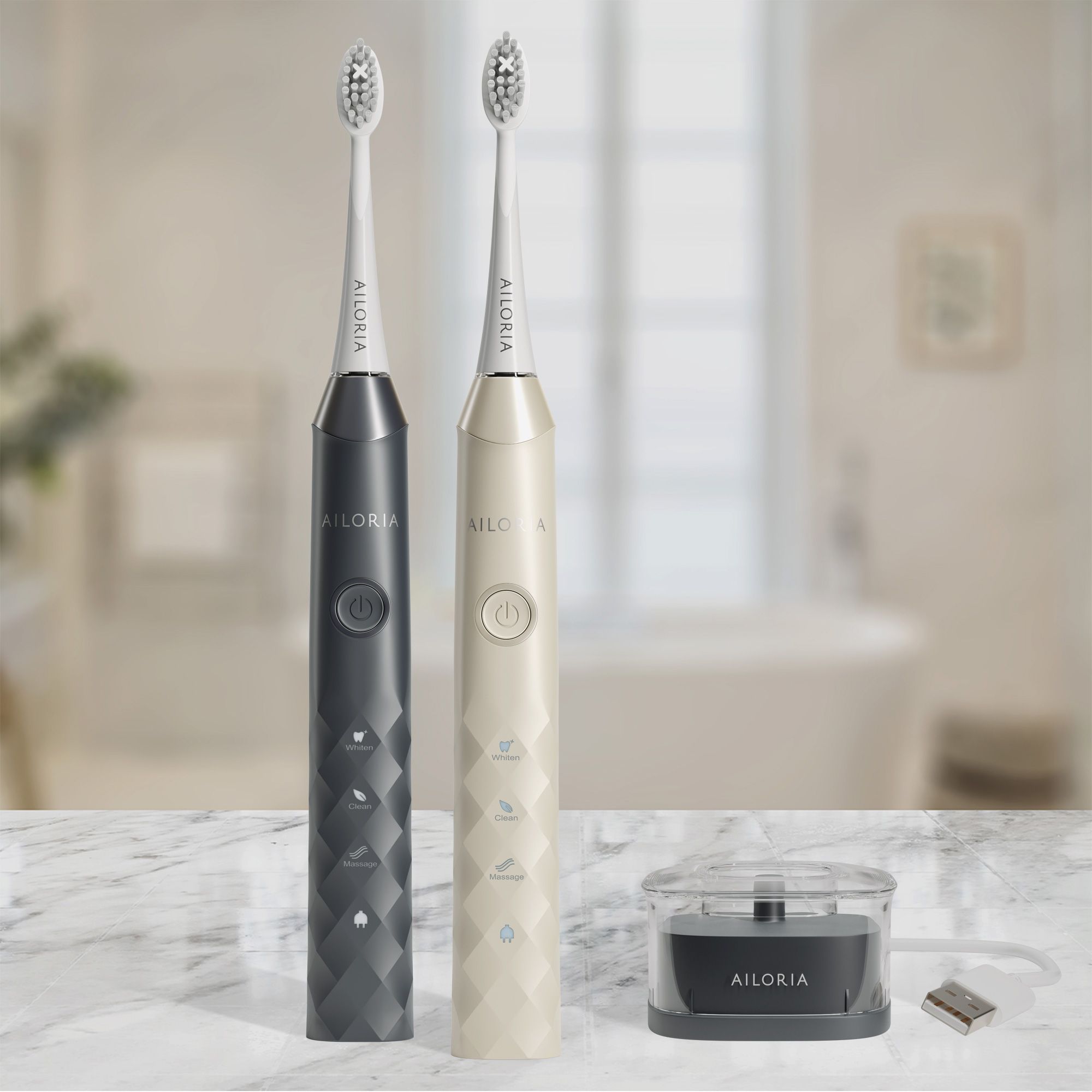 Deux brosses à dents électriques en noir et crème. Station de charge. Logo AILORIA.