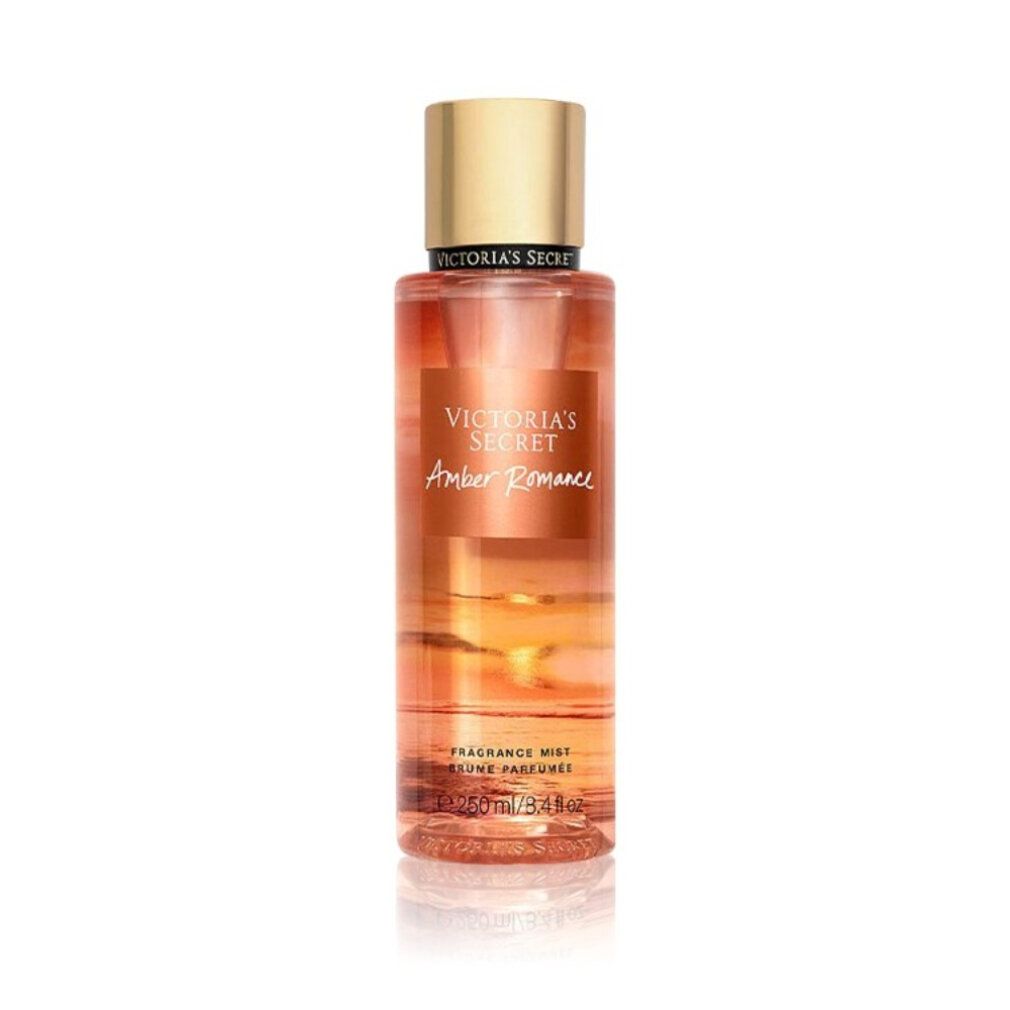 Victoria's Secret Amber Romance geurmist in een heldere fles met gouden dop.