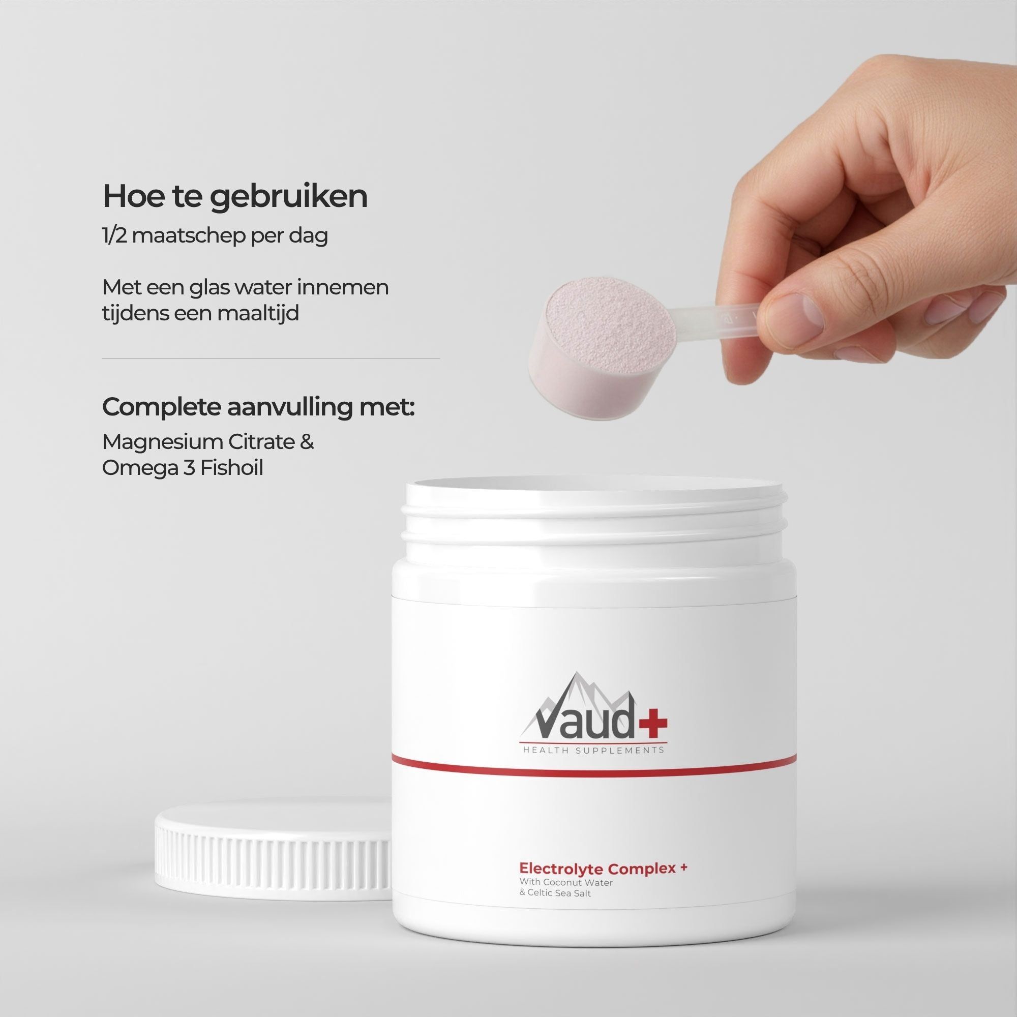 Witte pot met Vaud+ logo en "Electrolyte Complex" opschrift. Een schepje met poeder wordt erboven gehouden.