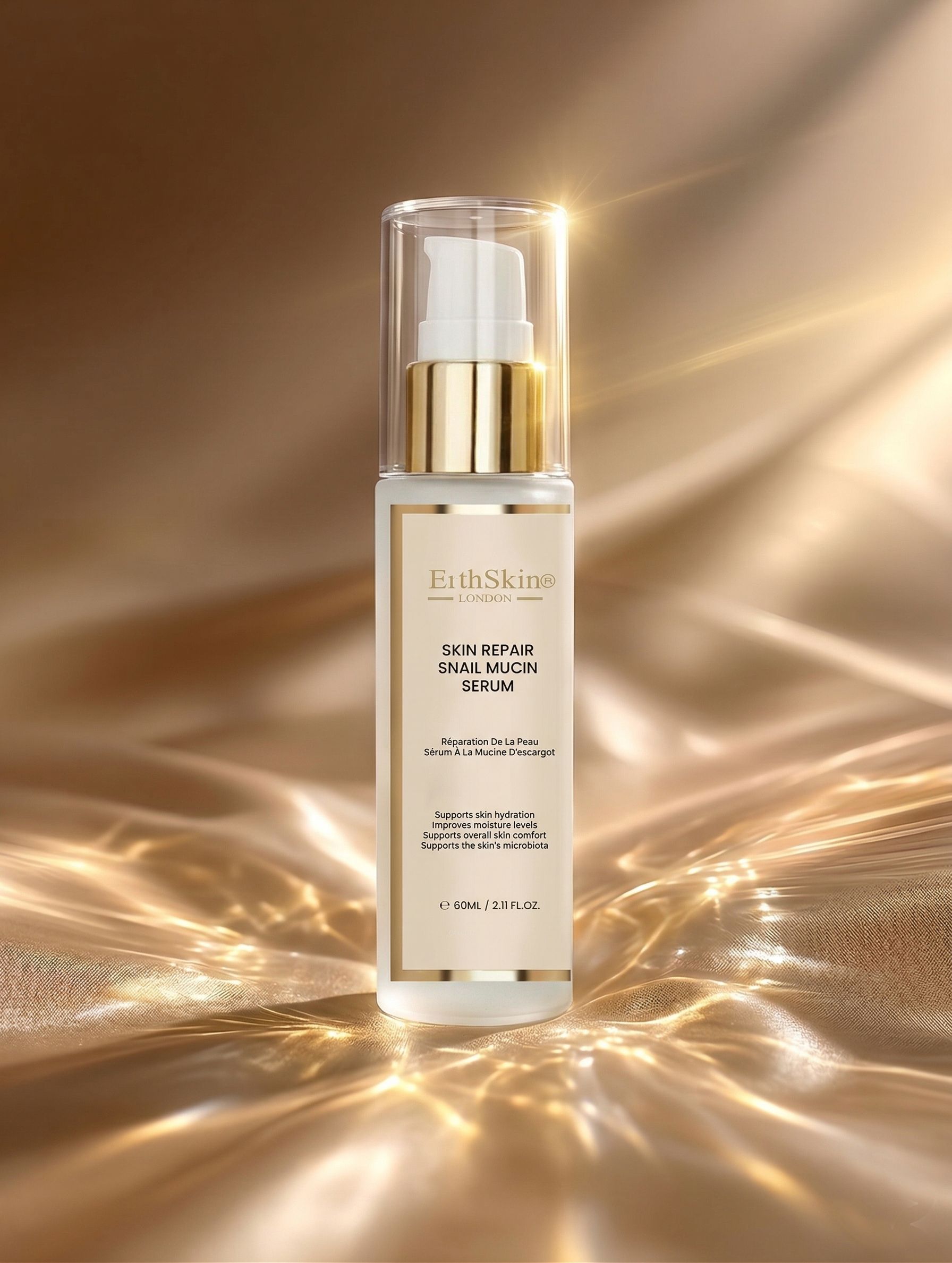 Fles met pompdos voor huidherstellend slakken slijm serum, op glanzende gouden stof.