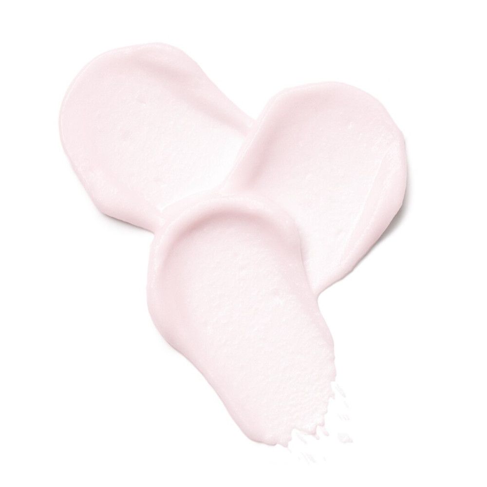 Drie romige roze productstreken op witte achtergrond. Textuur zichtbaar.