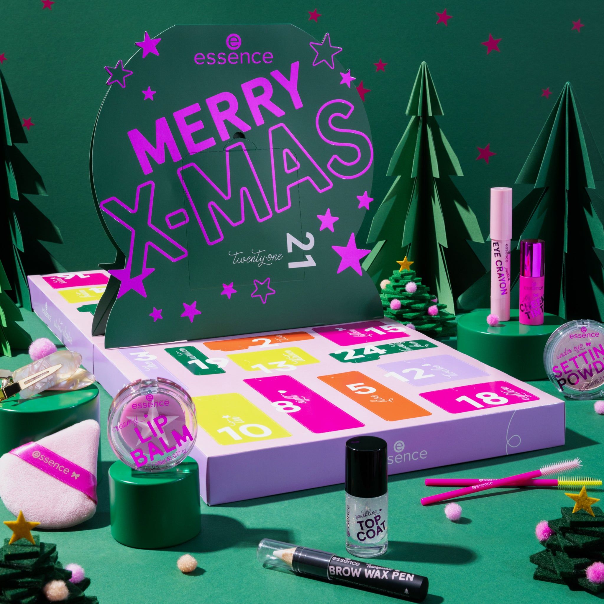 Adventskalender met 21 vakjes. Groen-roze design met opschrift « Merry X-Mas ». Bevat cosmetische producten.