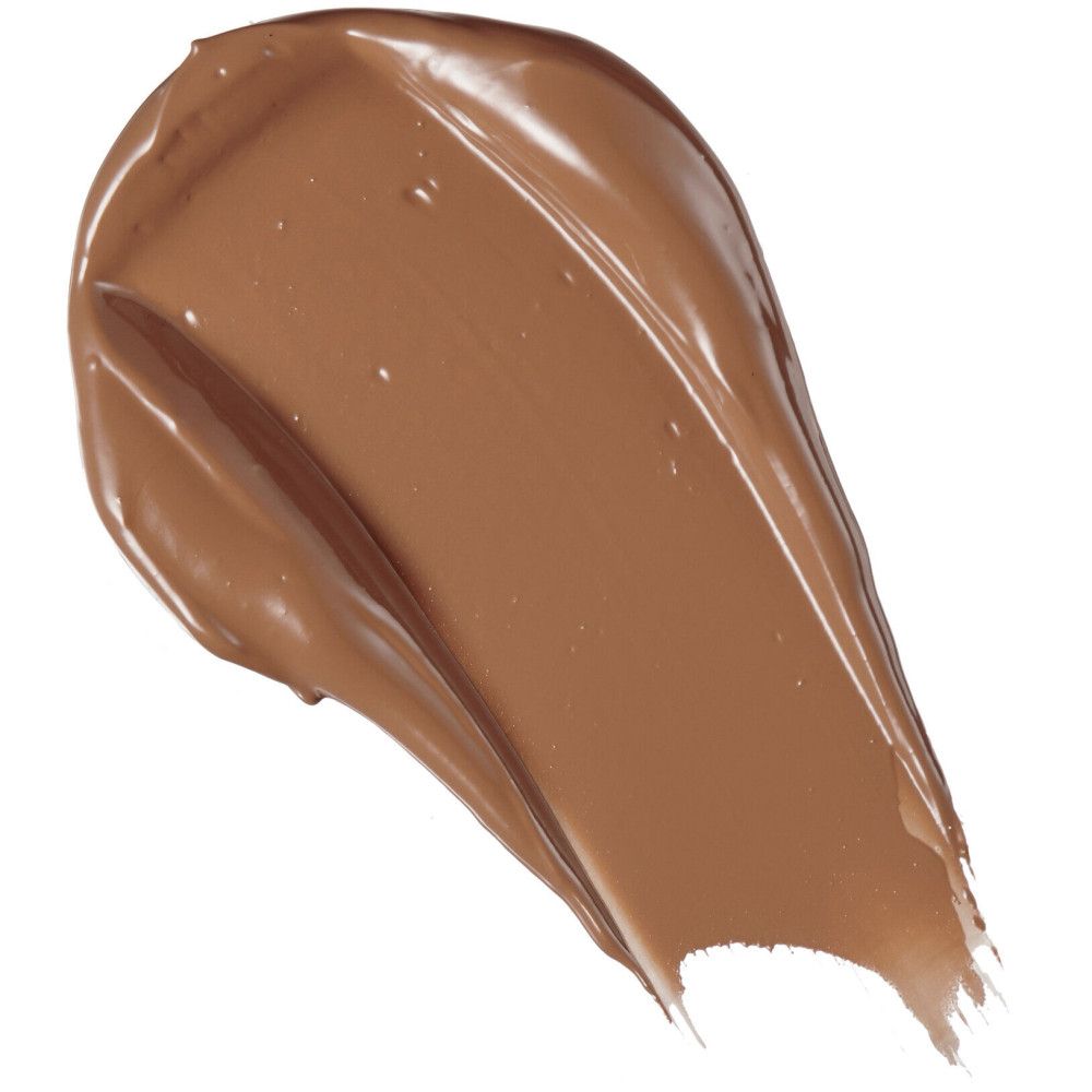 Échantillon de correcteur brun sur fond blanc. Texture brillante.