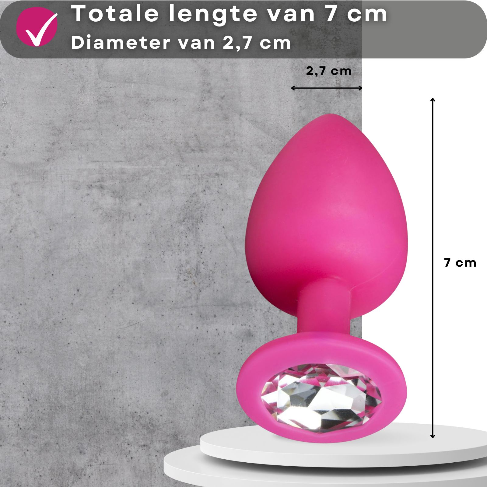 Roze anale plug met decoratieve steen. Afmetingen: 7 cm lang, 2,7 cm diameter.