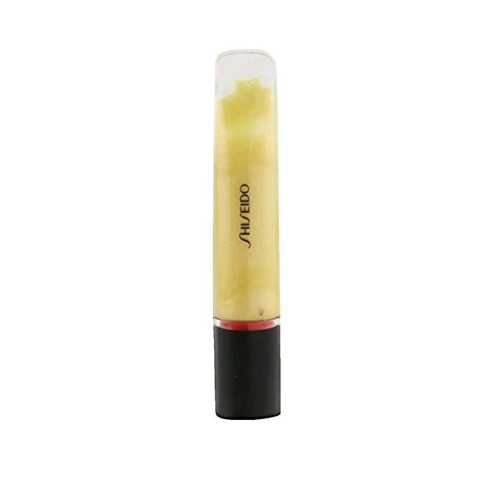Gloss en gel dans un tube transparent avec bouchon noir. Le mot SHISEIDO est imprimé. Couleur jaunâtre.
