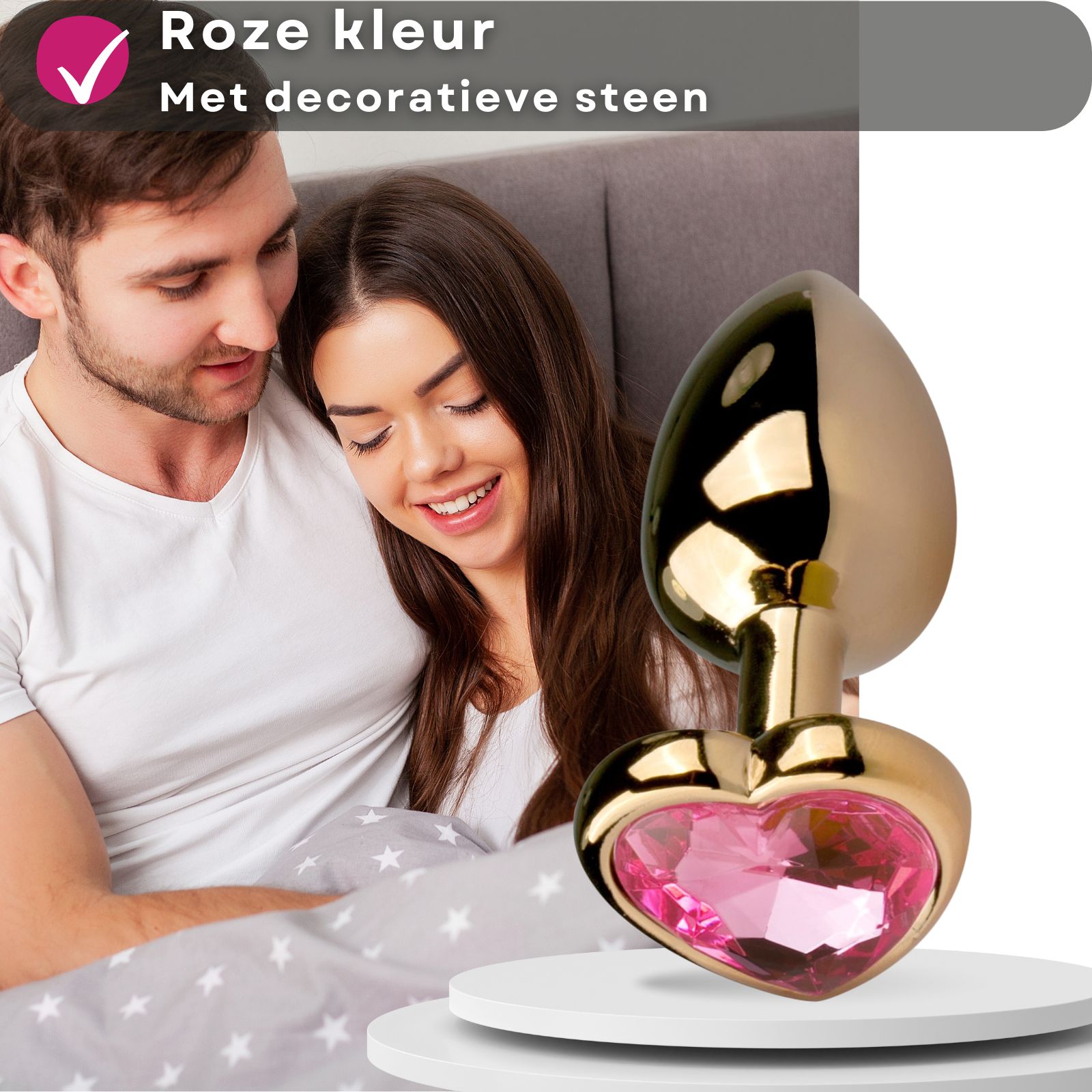 Gouden anale plug met hartvormige siersteen. Roze steen.