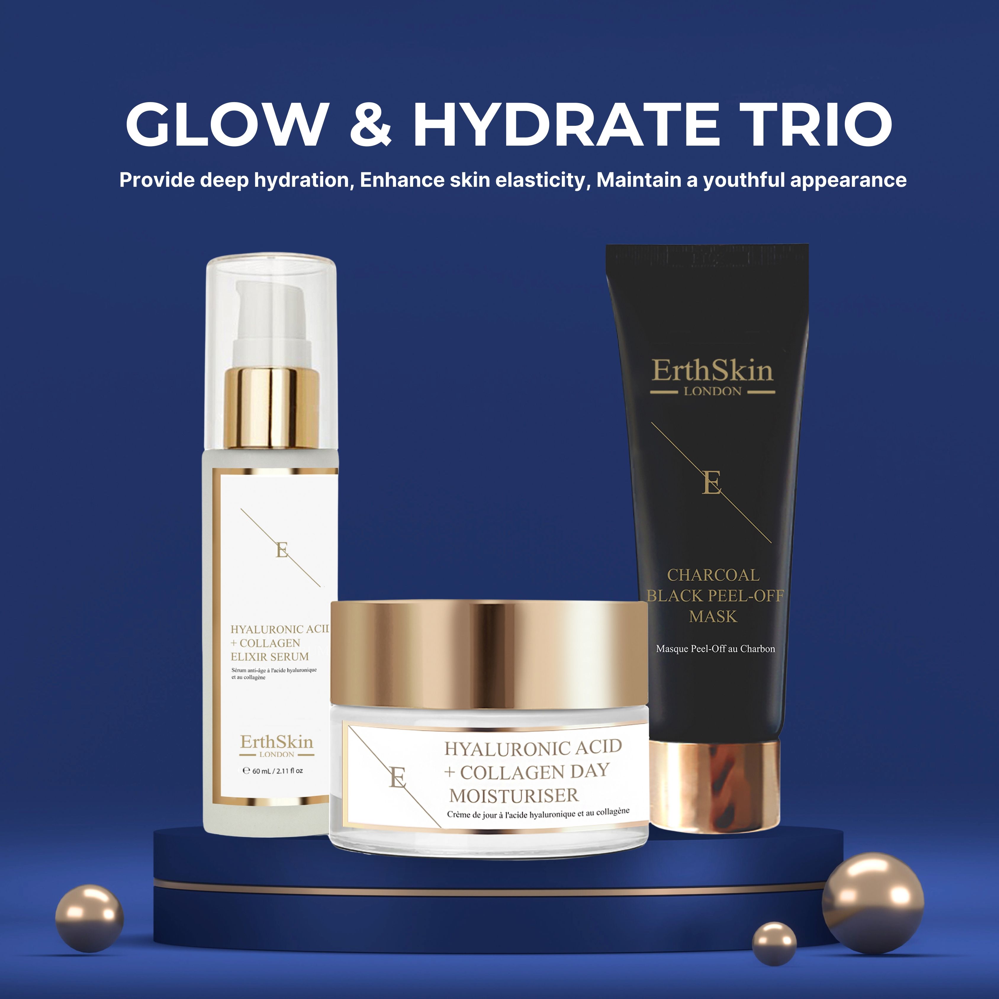 Ensemble cosmétique sur socle bleu. Sérum, crème de jour et masque. Boules dorées. Texte: Glow & Hydrate Trio.