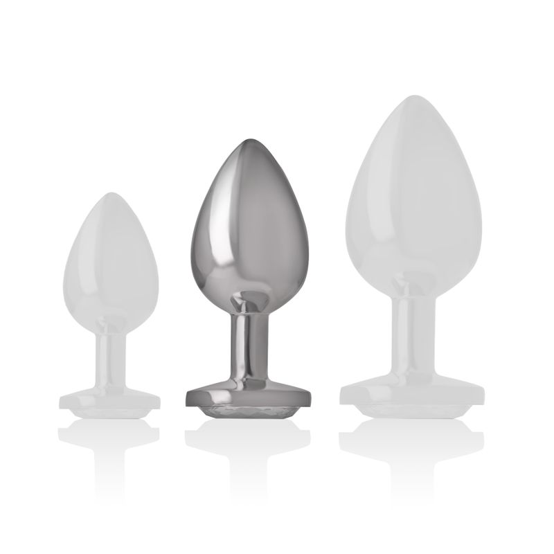 Vergelijking van drie anale plugs in verschillende maten. Middelste stuk van metaal.