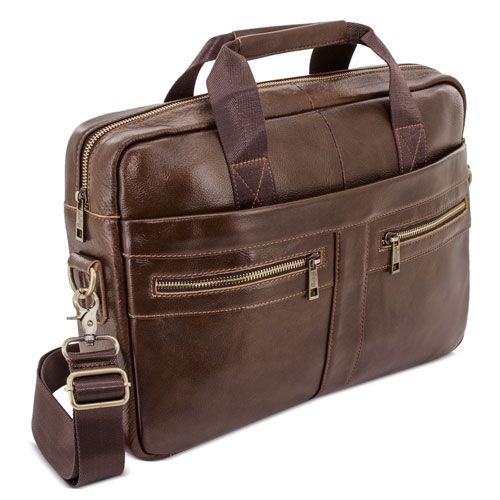 Bruine leren tas met ritsen, handvat en schouderriem. Metalen details.