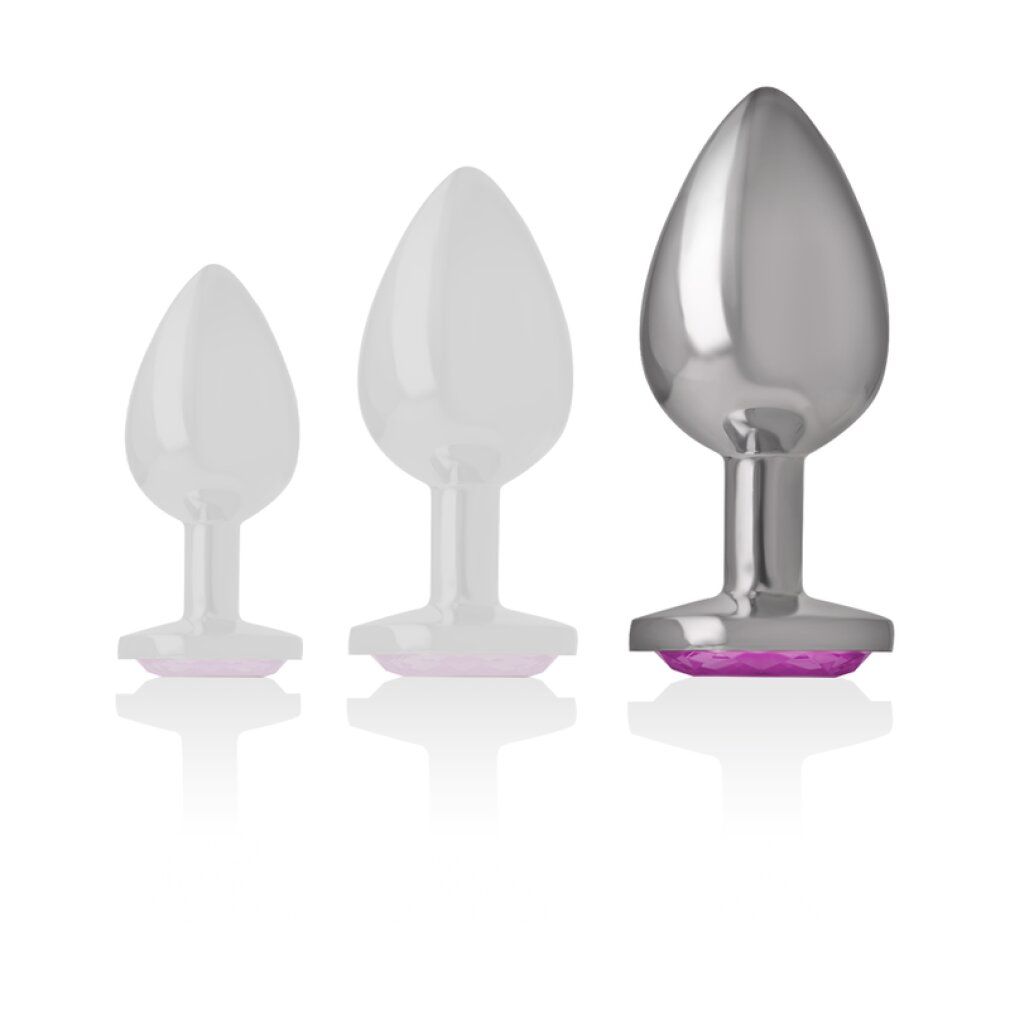Drie anale plugs in verschillende maten, één van metaal, twee transparant.