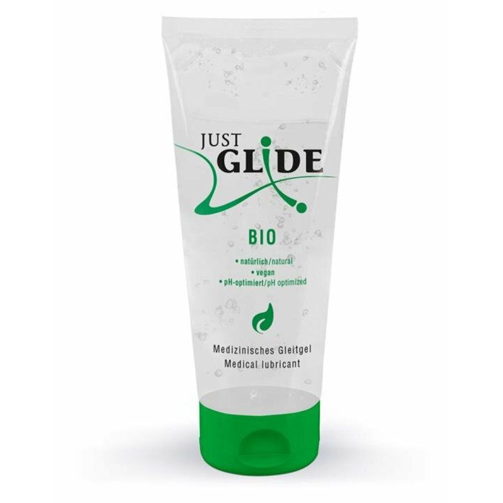 Tube transparent avec bouchon vert. Inscription : JUST GLIDE BIO. Contient des informations sur les ingrédients et les certifications.