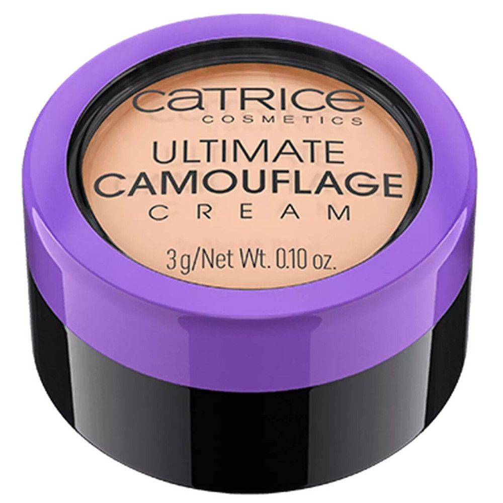 Pot noir rond avec couvercle violet. Le couvercle porte l'inscription "Catrice Ultimate Camouflage Cream".