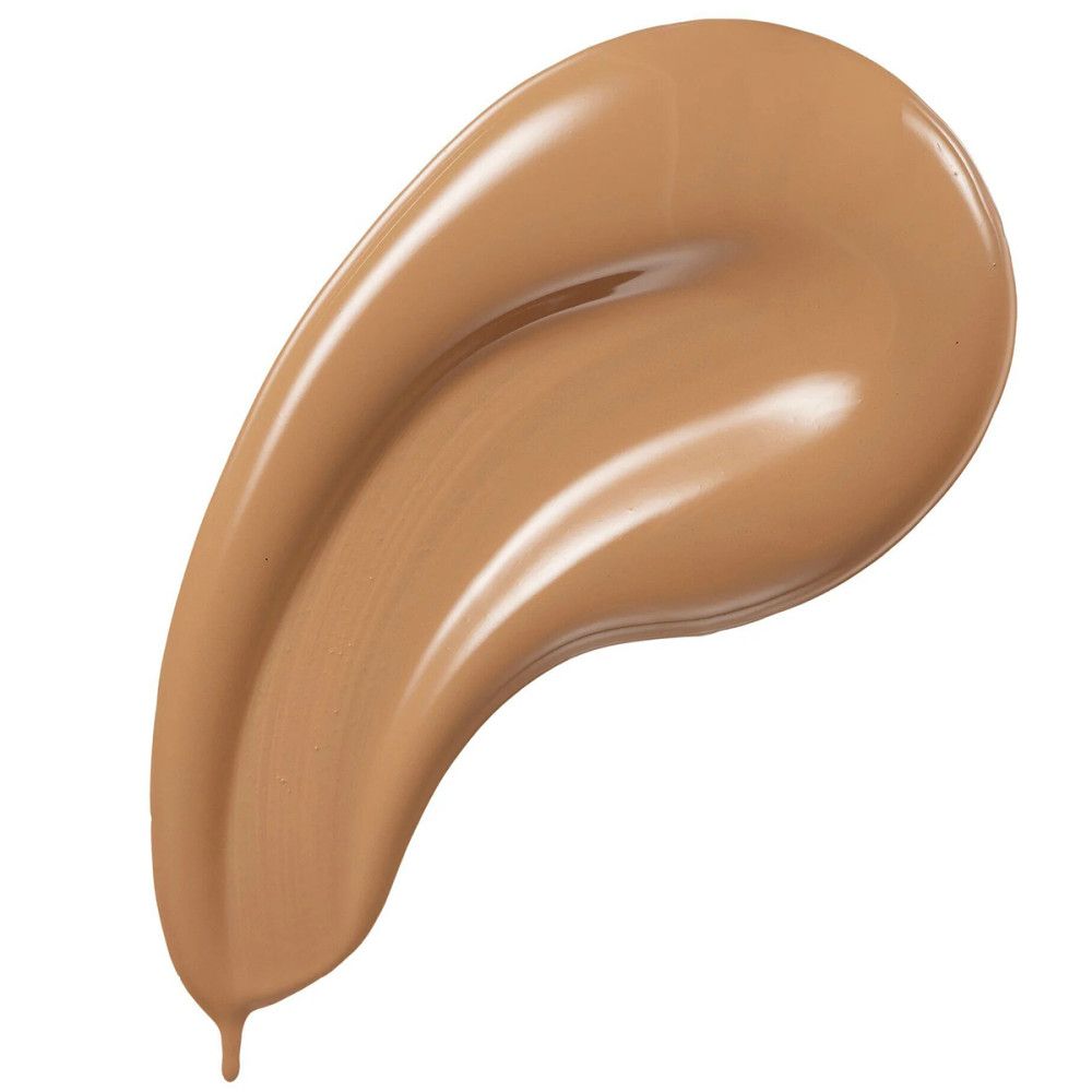 Veeg van vloeibare foundation. Lichtbruine tint. Glanzend oppervlak.