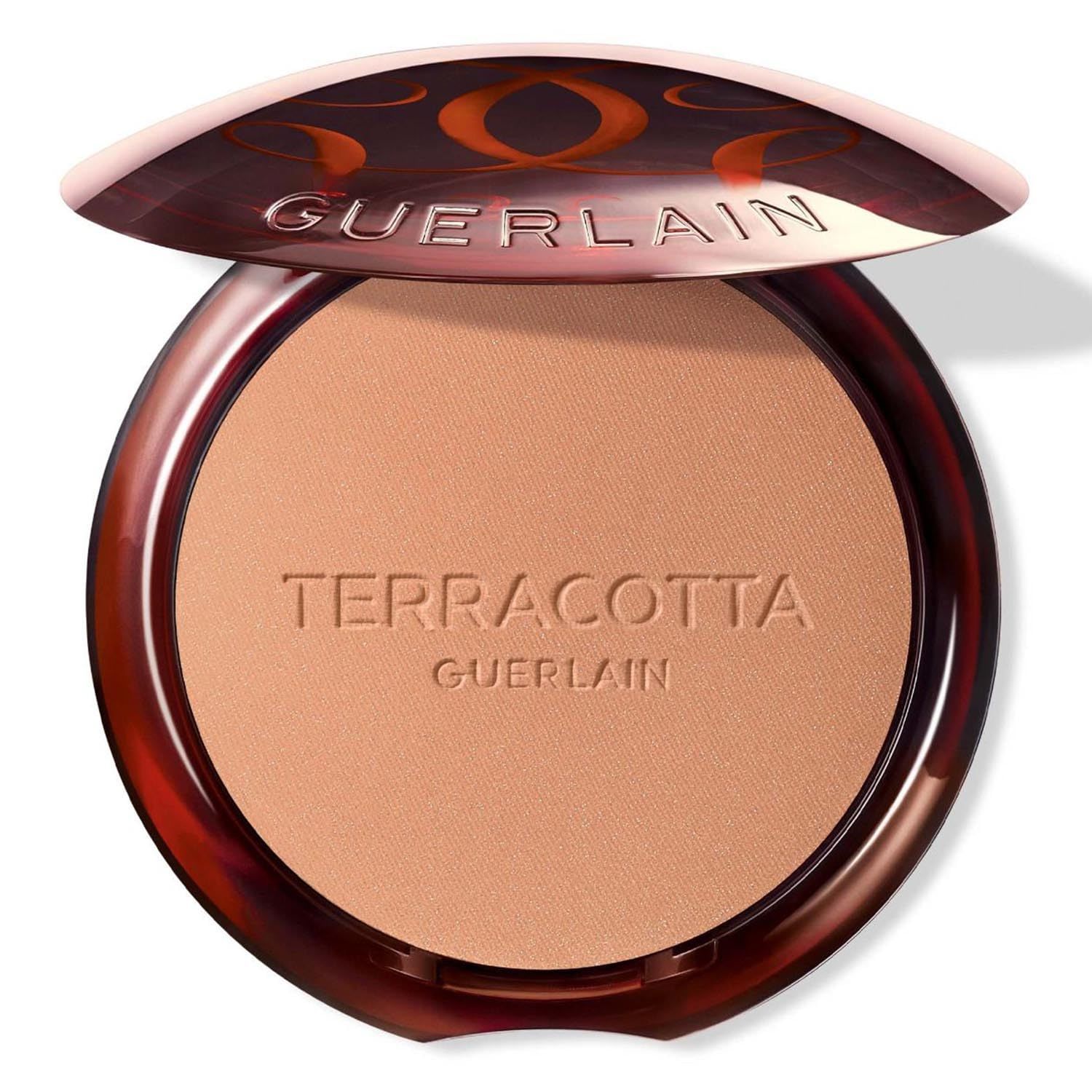Poudre compacte ronde marron avec couvercle ouvert. Inscription "TERRACOTTA" et "GUERLAIN" sur la poudre.
