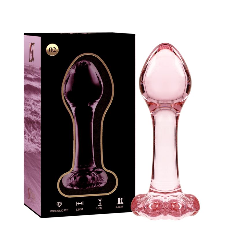 Plug anal en verre rose avec base large et décorations. 11 cm de long, 3,5 cm de large.