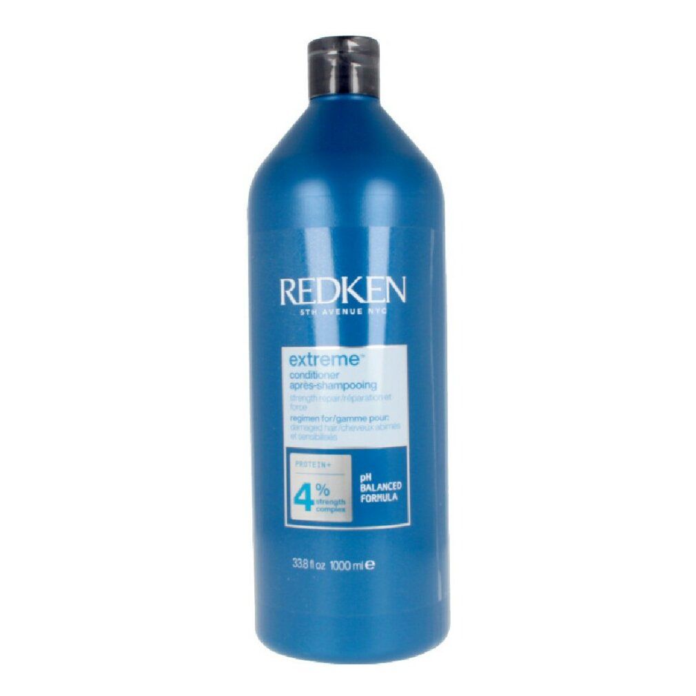 Flacon bleu Redken Extreme Conditioner. Bouchon noir. Texte: Extreme, Conditioner, 33.8 fl oz, 1000 ml.