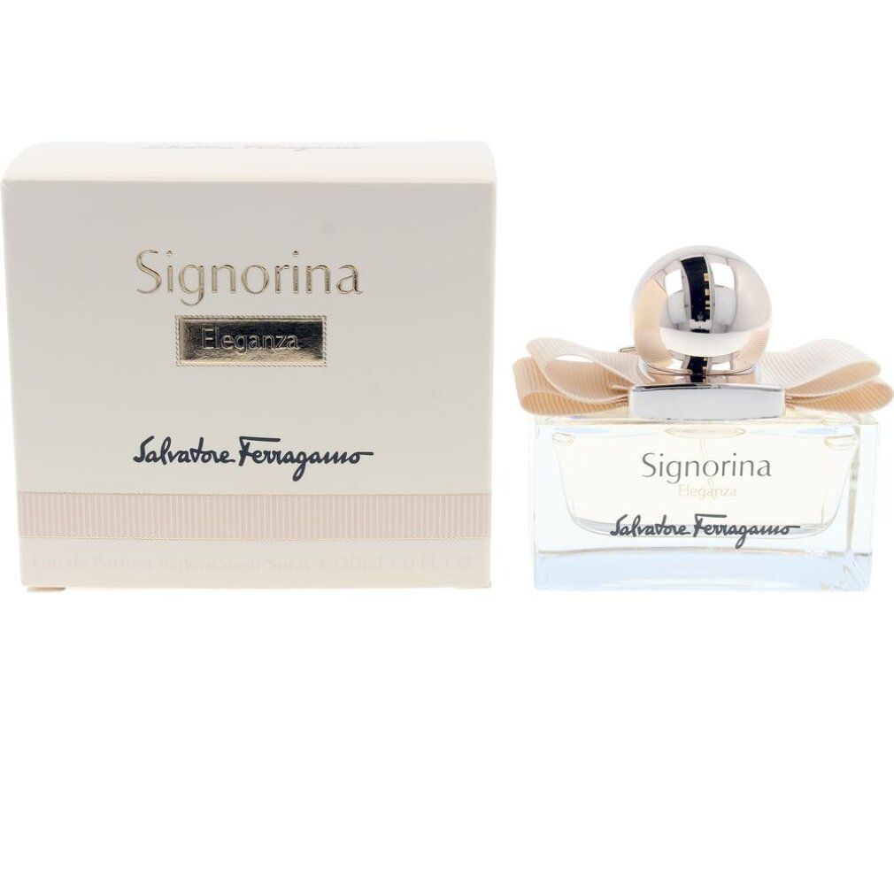 Flacon de parfum et emballage. Flacon avec nœud et bouchon doré. Inscription: Signorina Eleganza, Salvatore Ferragamo.