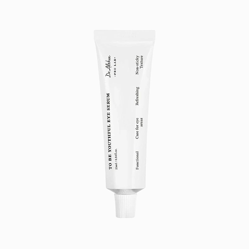 Witte tube met opschrift "TO BE YOUTHFUL EYE SERUM". Tekst: "Care for eye areas", "Refreshing", "Non-sticky Texture".