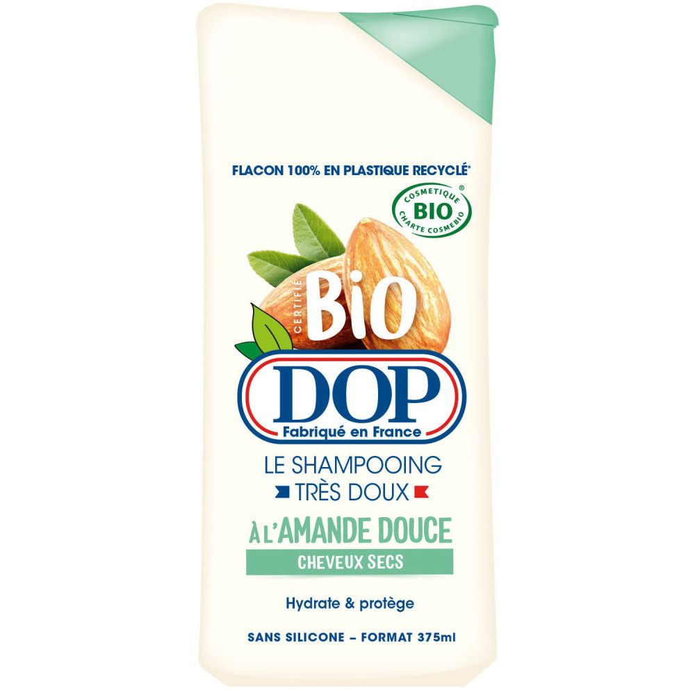 Wit shampoo flesje met groene dop. Opschrift: DOP, Bio, Amandel. Voor droog haar.
