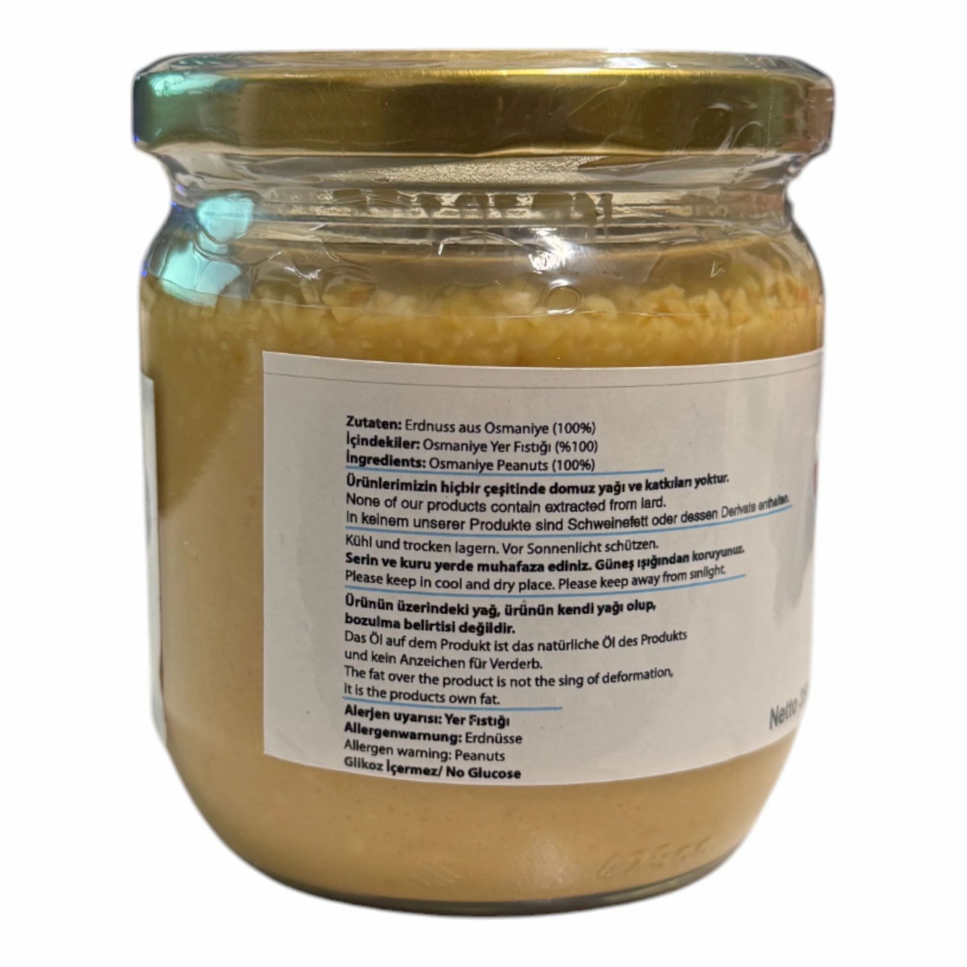 Vue arrière d'un pot de beurre de cacahuète. Étiquette avec texte turc. Contient des informations sur les ingrédients et les allergènes.