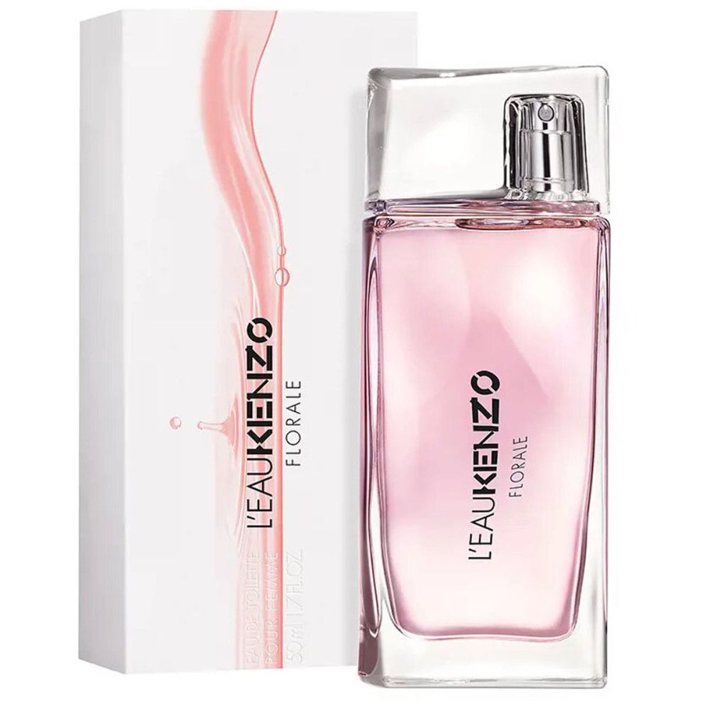 Fles en verpakking. Fles: rechthoekig, roze vloeistof, transparante dop. Verpakking: wit, roze design, zwarte tekst.