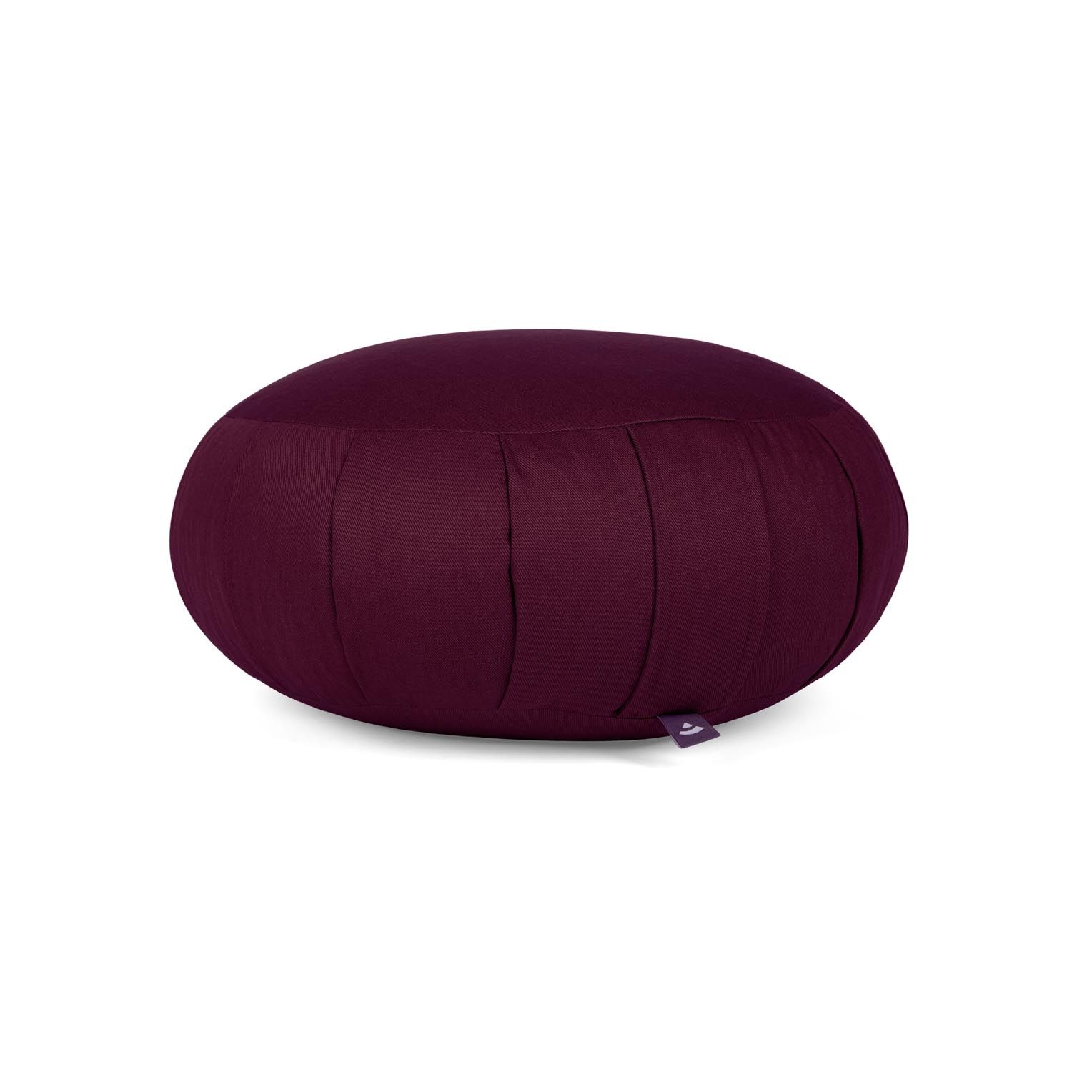 Bordeaux meditatiekussen ZAFU. Rond, met plooien en klein label. Op lichte achtergrond.